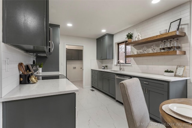 kitchen featuring gray cabinets, tasteful backsplash, dishwasher, sink, and range