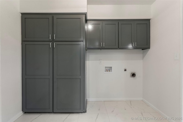 laundry room featuring gas dryer hookup, cabinets, hookup for a washing machine, and electric dryer hookup