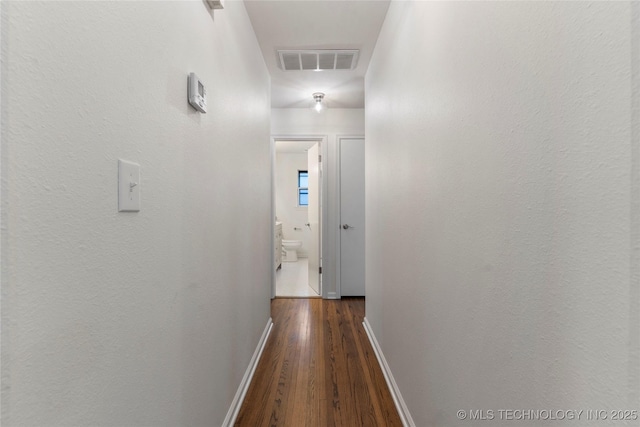 hallway featuring dark hardwood / wood-style floors