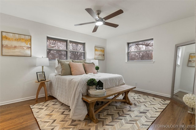 bedroom featuring hardwood / wood-style flooring and ceiling fan