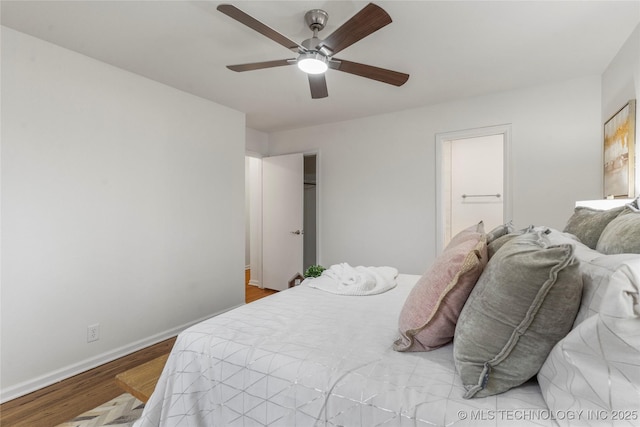 bedroom featuring hardwood / wood-style flooring, ceiling fan, and ensuite bathroom