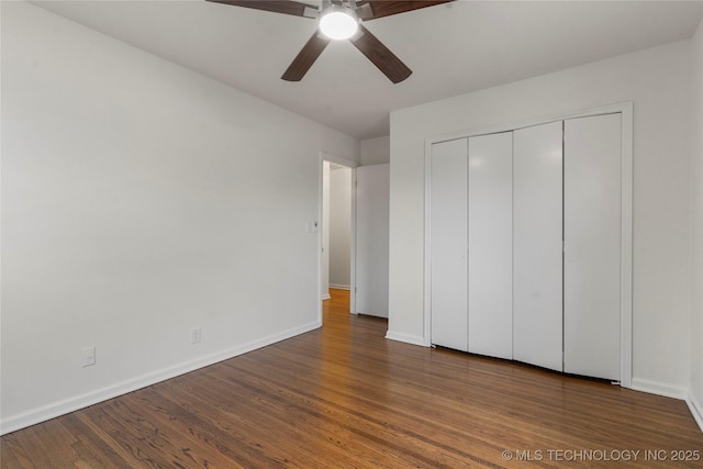 unfurnished bedroom featuring wood-type flooring, ceiling fan, and a closet