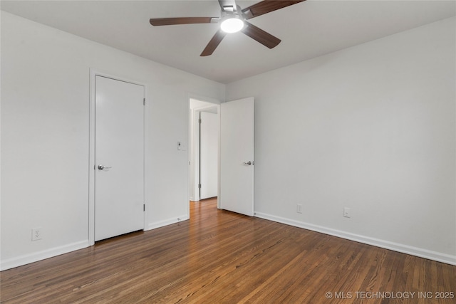 unfurnished bedroom with dark hardwood / wood-style floors and ceiling fan