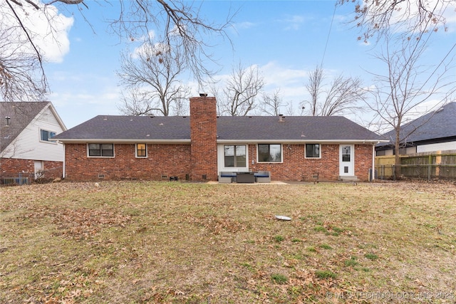 back of property featuring a yard and a patio