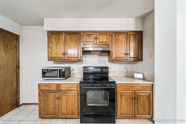 kitchen featuring black range with electric cooktop and light tile patterned flooring