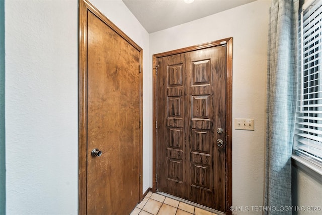 view of tiled foyer entrance