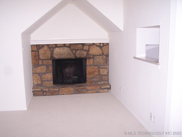 room details with carpet flooring and a stone fireplace