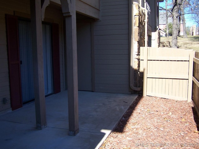 view of side of property with a patio area