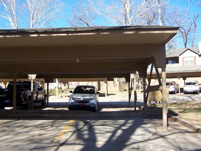 view of vehicle parking with a carport