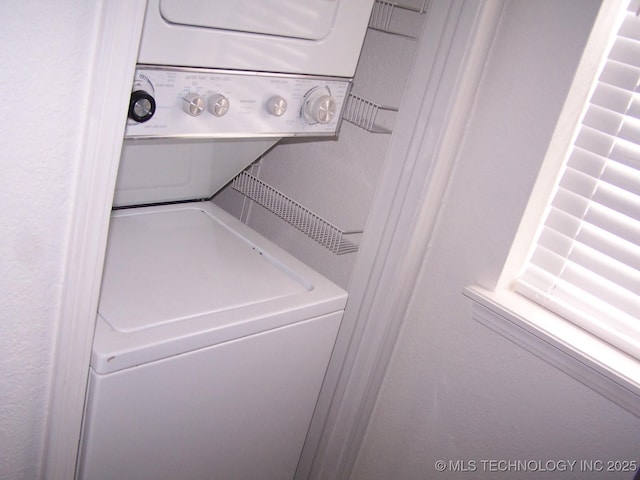 laundry area with stacked washer / dryer