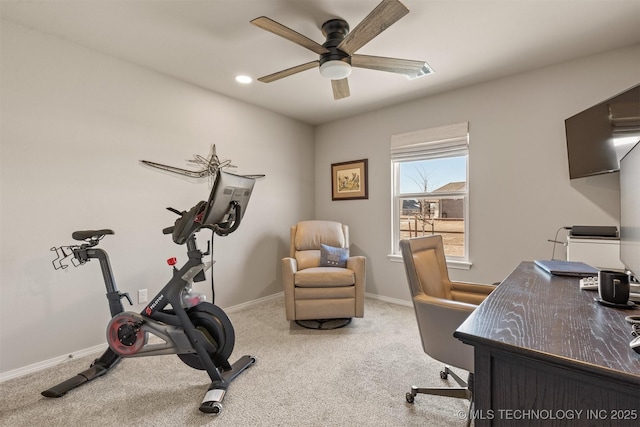 home office featuring ceiling fan and carpet