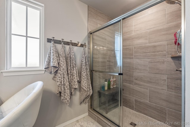 bathroom featuring a shower with shower door