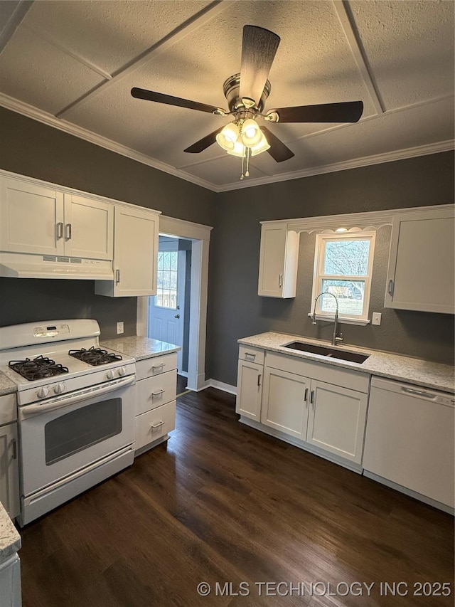 kitchen with dark wood-type flooring, sink, crown molding, white appliances, and white cabinets