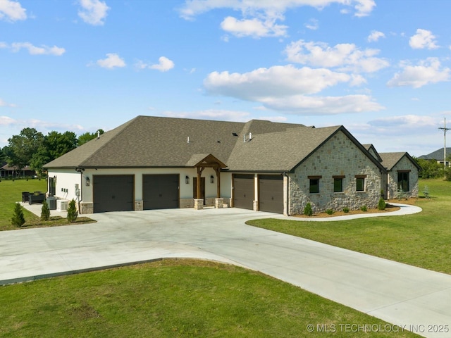 view of front of home featuring a garage and a front lawn