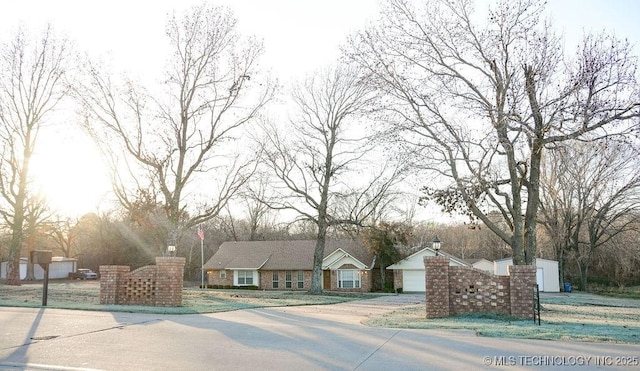 view of front of home with an outbuilding and a garage