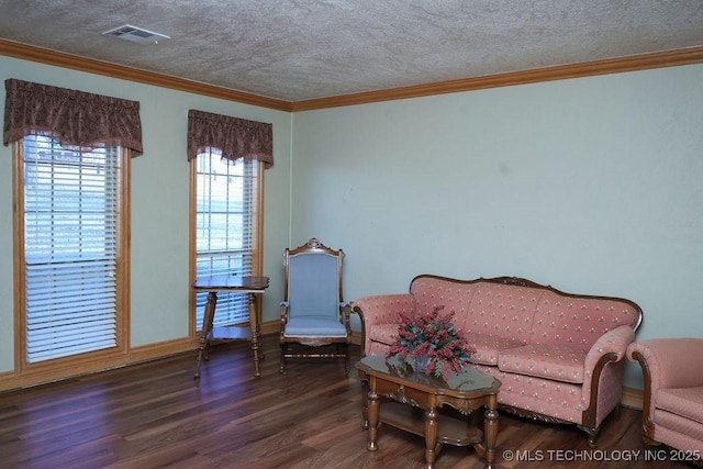 sitting room with crown molding, dark hardwood / wood-style floors, and a textured ceiling