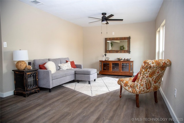 living room with ceiling fan and wood-type flooring