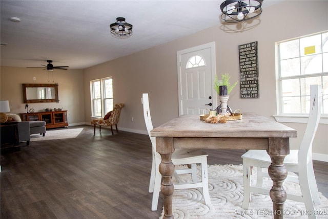 dining area featuring dark wood-type flooring and ceiling fan