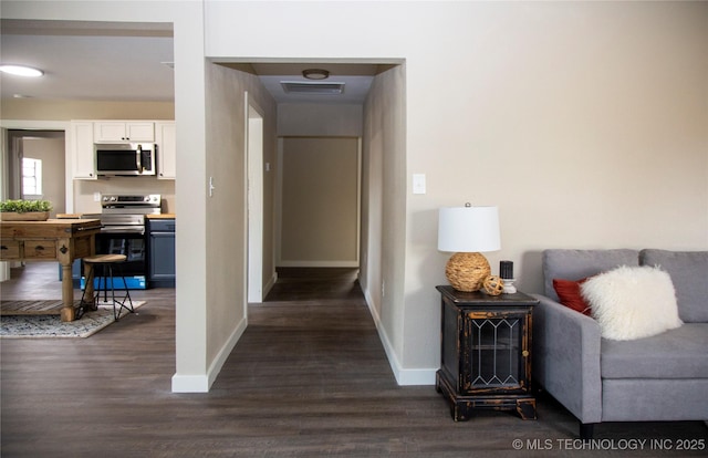 hall with dark hardwood / wood-style flooring