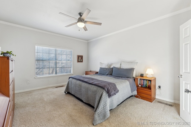 carpeted bedroom featuring crown molding and ceiling fan