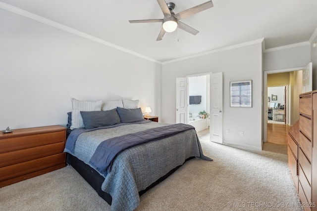 bedroom with ornamental molding, connected bathroom, light carpet, and ceiling fan