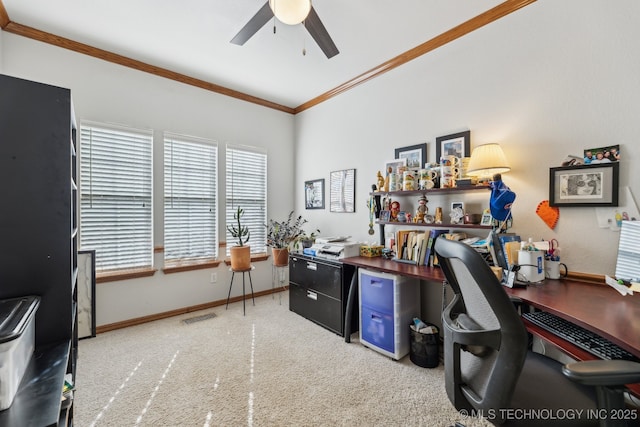 carpeted office space with ornamental molding and ceiling fan