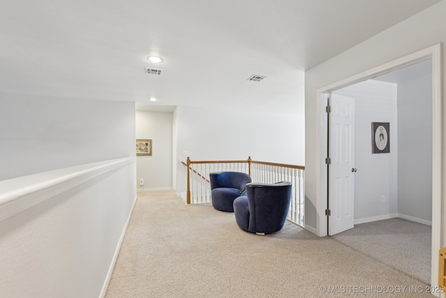 living area with light carpet