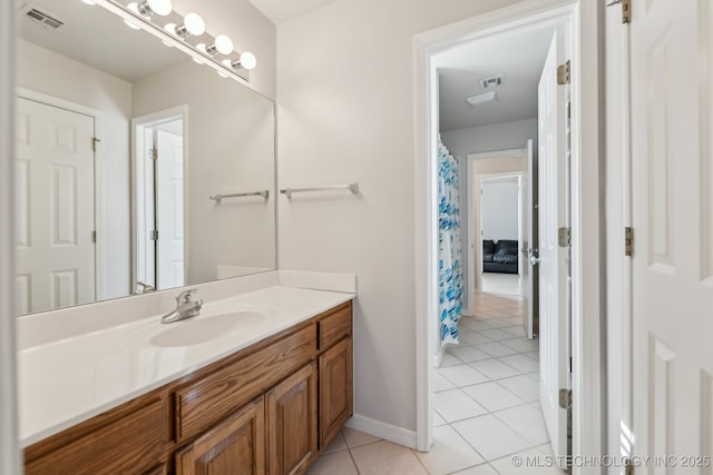 bathroom with vanity and tile patterned floors