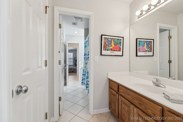 bathroom featuring tile patterned floors and vanity