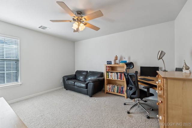 office area with carpet floors and ceiling fan