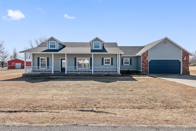 view of front of home with a porch and a garage