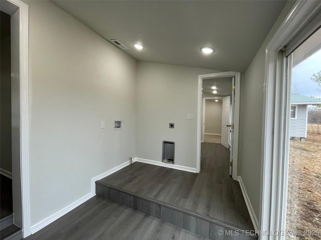 laundry area featuring electric dryer hookup, washer hookup, and dark hardwood / wood-style flooring