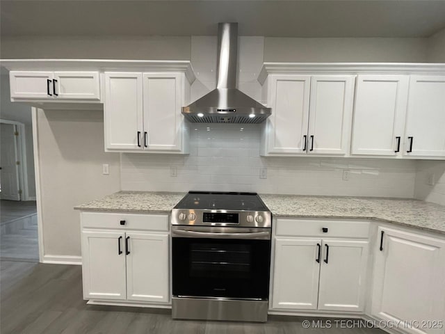 kitchen featuring extractor fan, white cabinetry, stainless steel electric range oven, light stone countertops, and backsplash