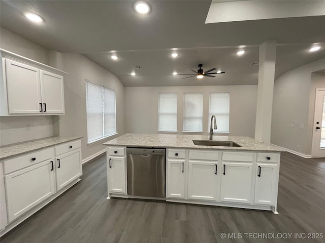 kitchen with sink, dishwasher, white cabinetry, light stone countertops, and a center island with sink