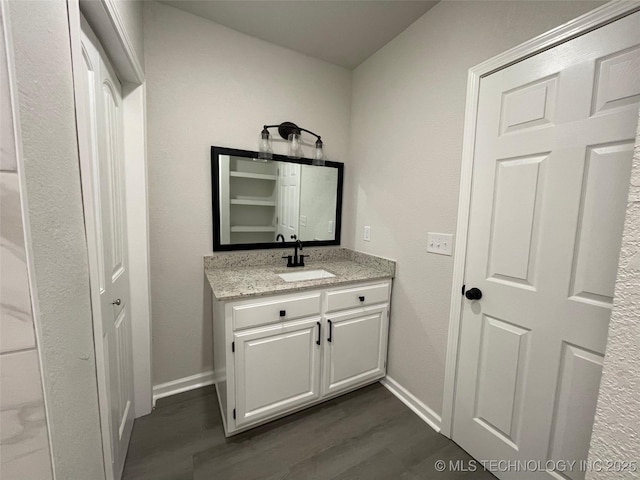 bathroom featuring hardwood / wood-style flooring and vanity