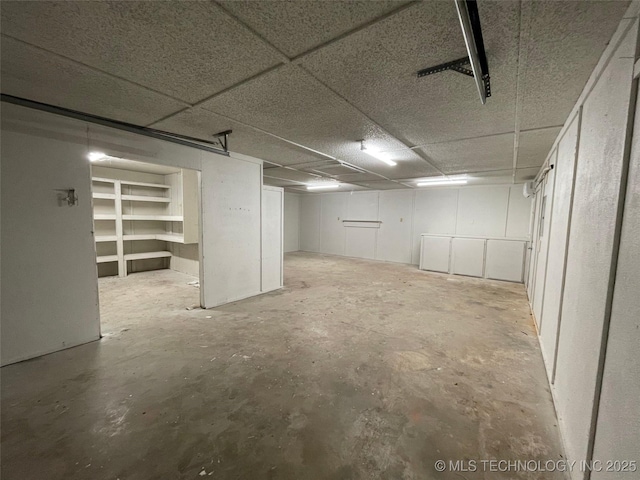 basement featuring a drop ceiling