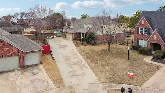 view of front of property with a garage and a front yard