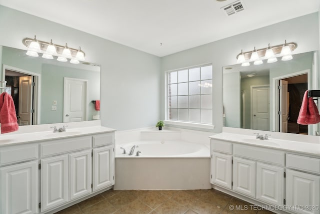 bathroom featuring vanity, tile patterned floors, and shower with separate bathtub