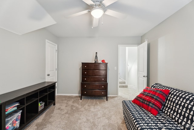 bedroom featuring light colored carpet and ceiling fan