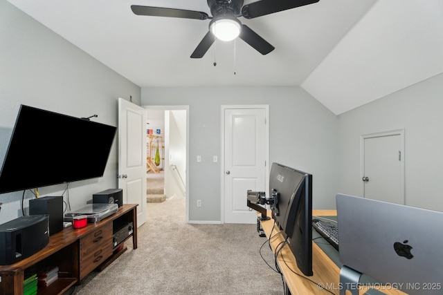 office with ceiling fan, vaulted ceiling, and light carpet