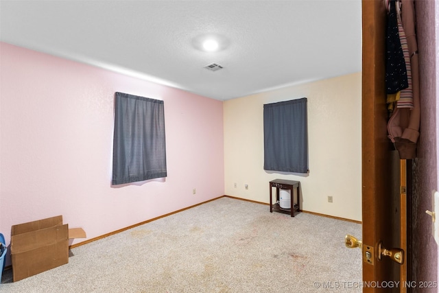 empty room featuring carpet flooring