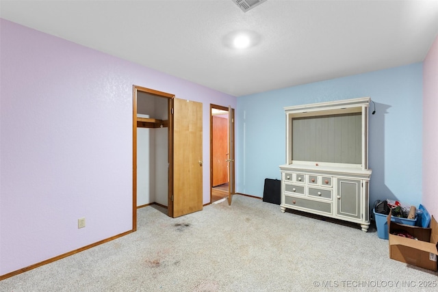 unfurnished bedroom with light colored carpet