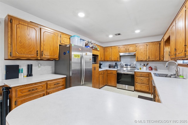 kitchen featuring stainless steel appliances and sink