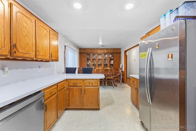 kitchen featuring stainless steel appliances and kitchen peninsula