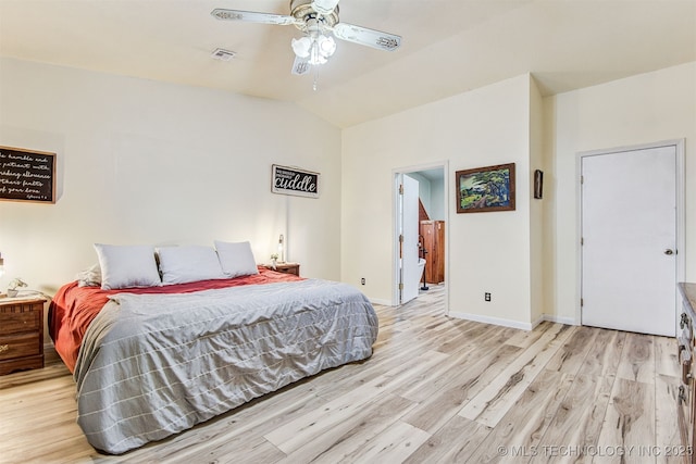 bedroom featuring vaulted ceiling, ceiling fan, and light hardwood / wood-style flooring