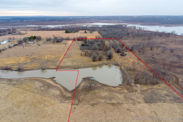 bird's eye view featuring a water view and a rural view