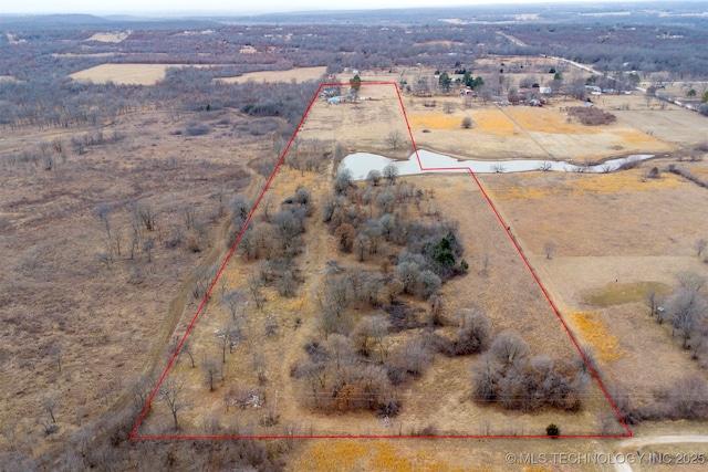 birds eye view of property featuring a rural view