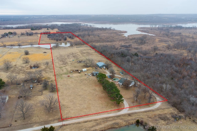 drone / aerial view featuring a water view and a rural view