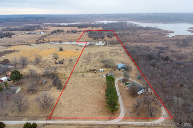 birds eye view of property featuring a rural view and a water view