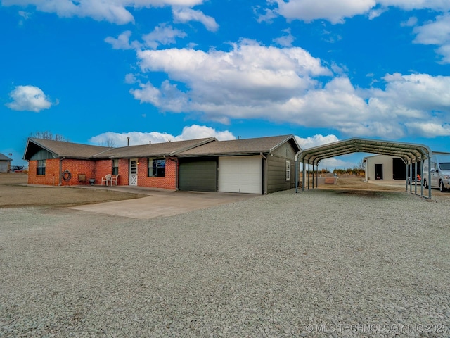 single story home featuring a garage and a carport